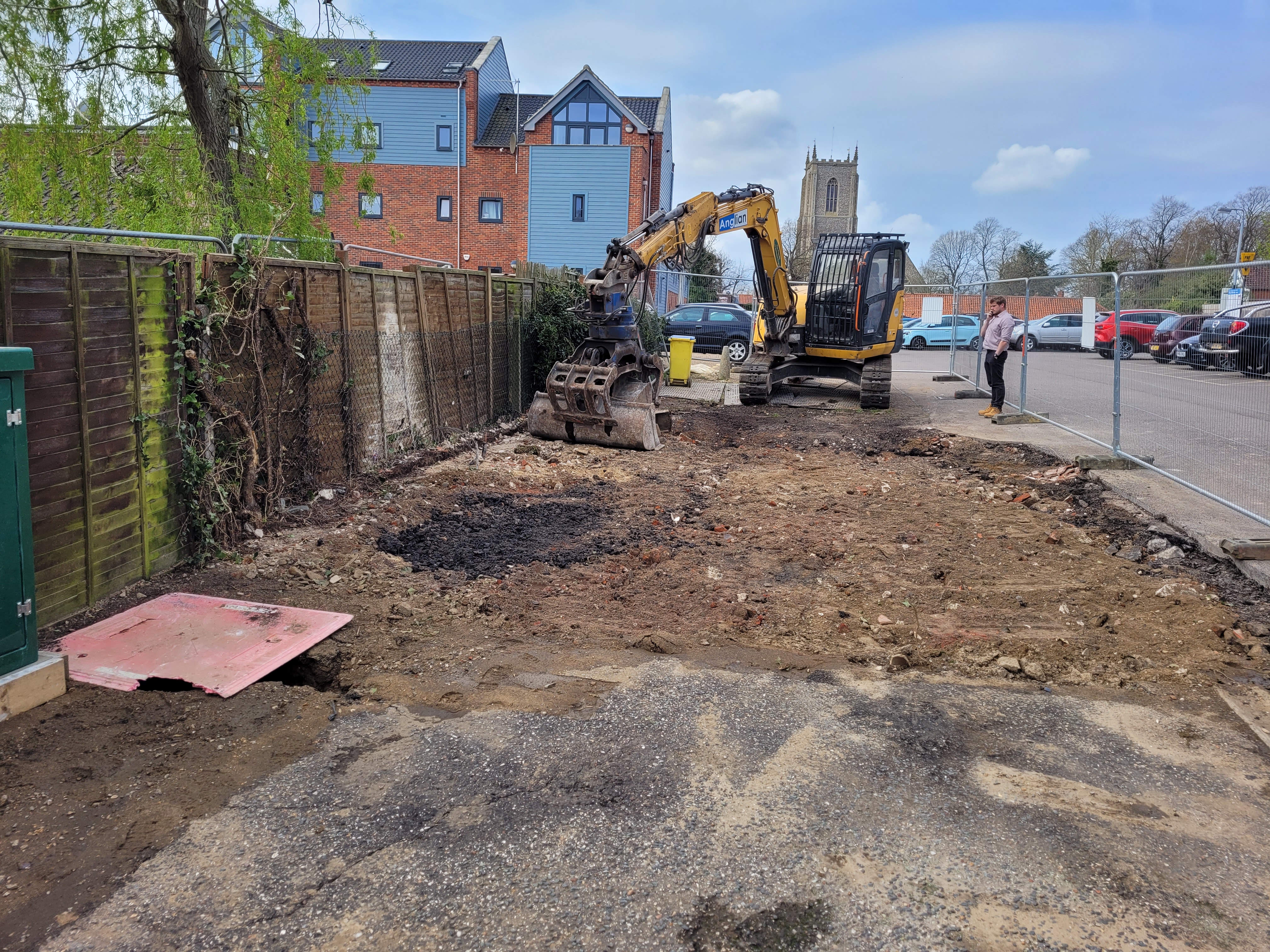 Digger and image of Fakenham toilet demolition